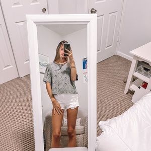 Vintage Havana grey short sleeve distressed shirt with black stars.